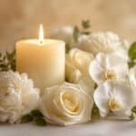 White candle centerpiece with elegant blooms, meaningful keepsakes, cremation services in St. Charles, MO
